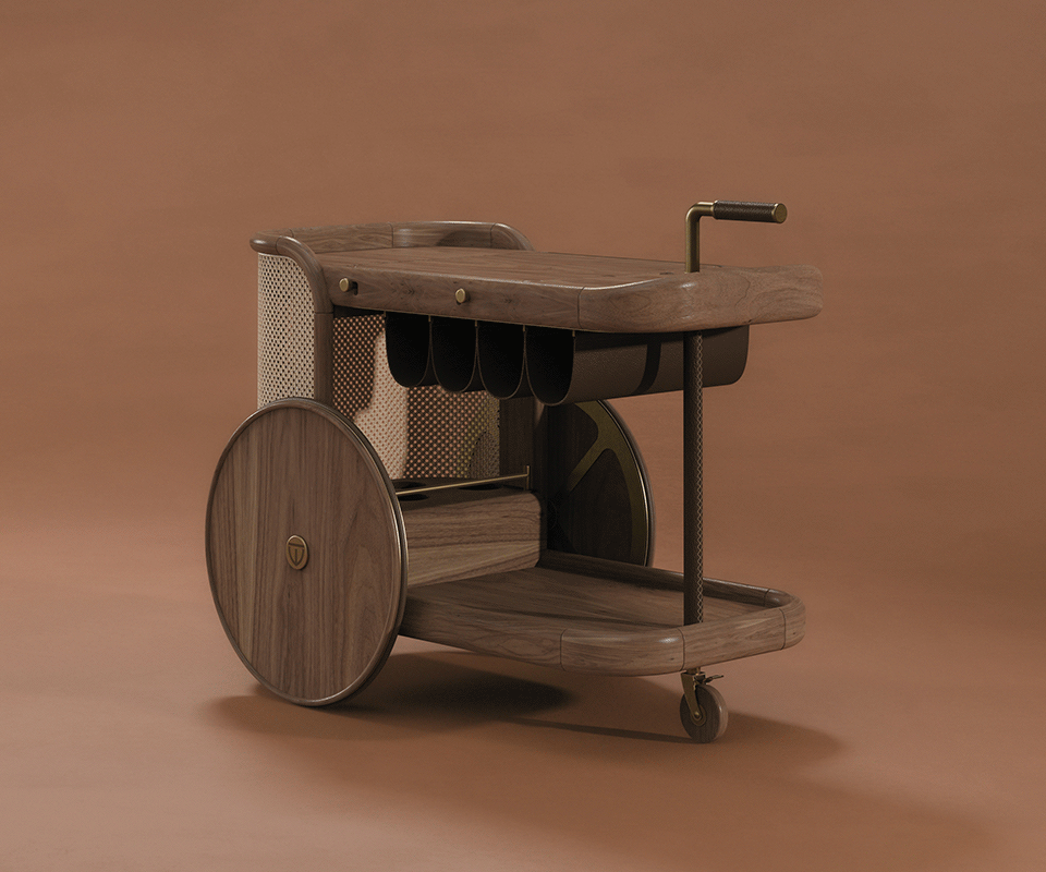 The New Icon Brinsley Bar Cart at a 45° angle, highlighting the natural rattan weave, walnut wood frame, and wooden wheels, set against a warm brown background that emphasizes its textures and craftsmanship.