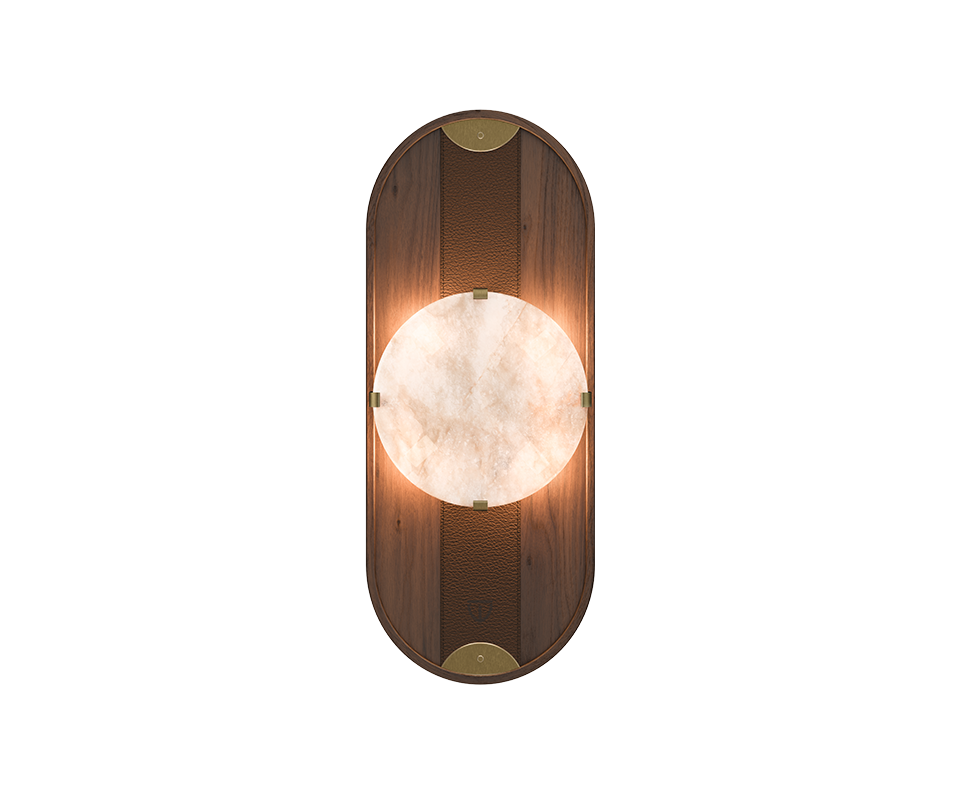Cavendish Wall Lamp, front view, with the light turned on. Crafted from smoked walnut wood and alabaster, framed in a gentle oval silhouette with aged brushed brass accents, showcasing the lamp’s refined materials and elegant design.