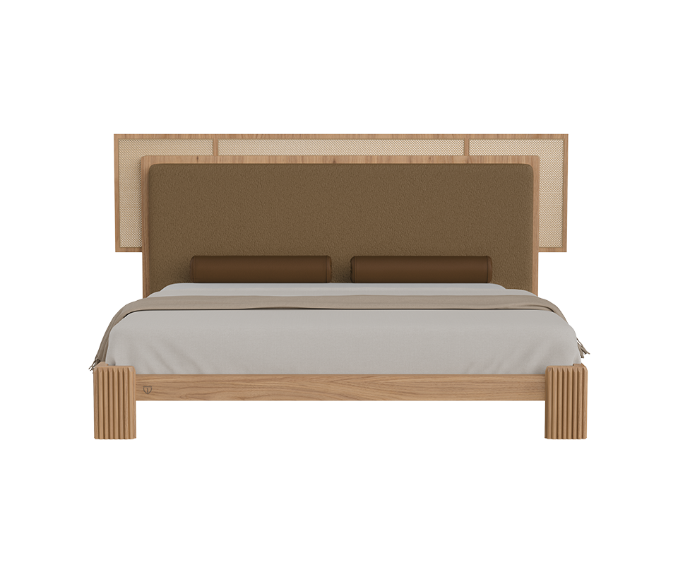 Forbes bed front view featuring a fabric and rattan headboard, cylindrical leather bolster pillows, and a oak wood frame.