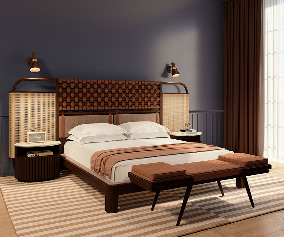 Herbert Bedside Table in a bedroom with blue and brown tones, placed next to the O'Connel Bed and the Milton Bench upholstered in orange fabric.