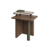 Maurier side table, 45-degree front view. A single cylindrical leg wrapped in supple leather flows into a balanced wooden frame, supporting a smooth travertine tabletop. A small removable leather tray rests atop, blending practicality with understated elegance.