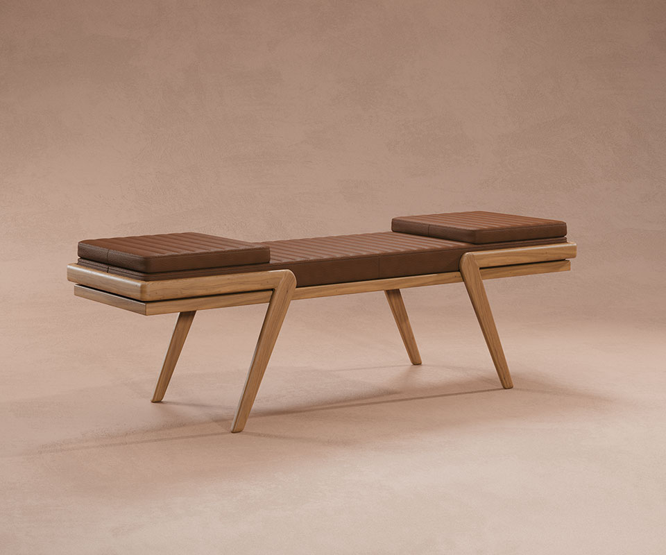 Milton Bench with a natural oak frame and orange leather upholstery, combining warm tones and refined craftsmanship, set against a cream background.