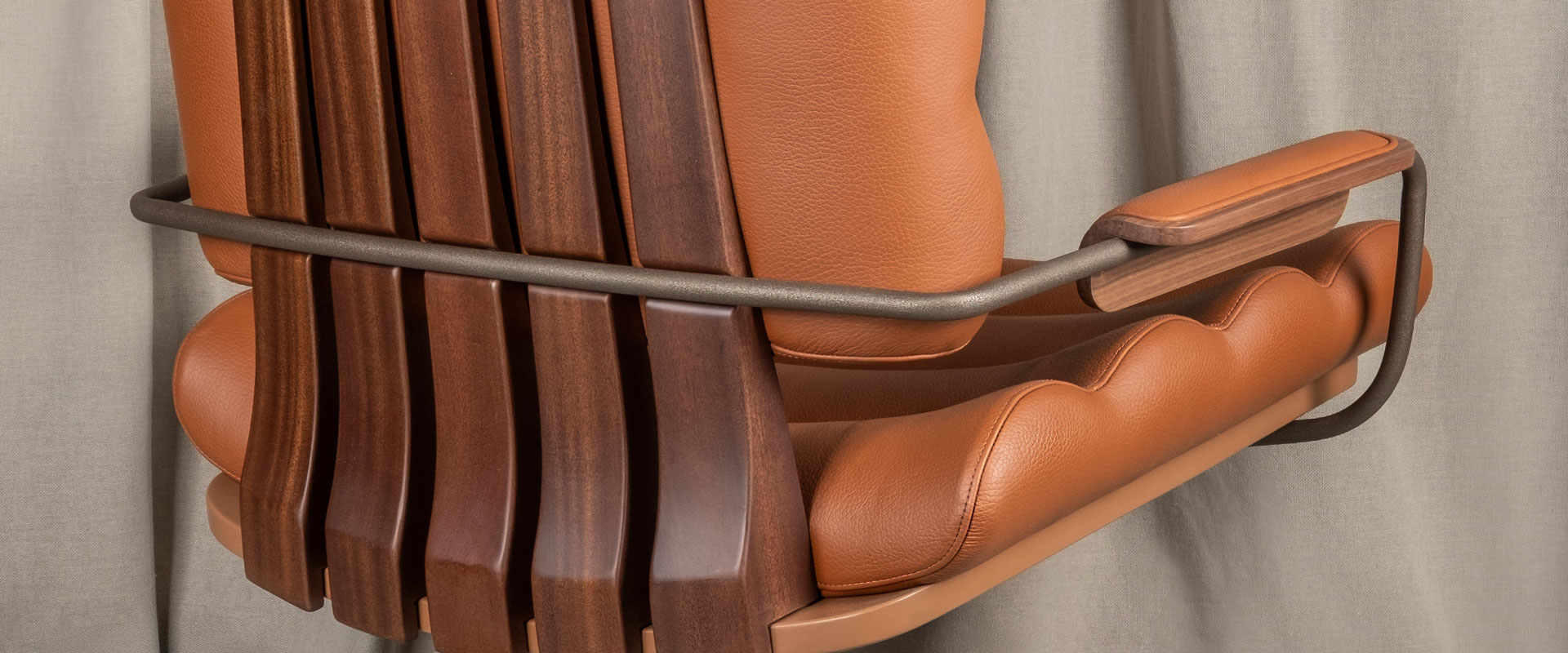 Thomas I Office Chair Close-up of the Thomas I office chair, highlighting the rich texture of orange genuine leather, the warmth of smoked walnut wood and powder-coated stainless steel.